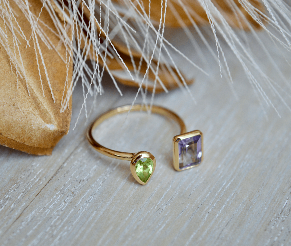 Gold pear shaped peridot and emerald cut amethyst split ring