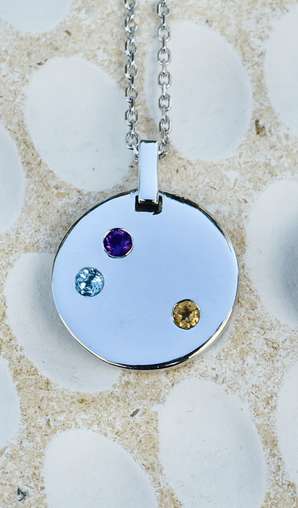 Sterling silver disc necklace with amethyst, blue topaz and citrine gemstones for health and well-being