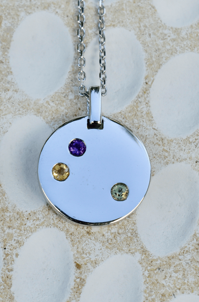 Sterling silver disc pendant with three natural gemstones amethyst, citrine and peridot for bereavement 